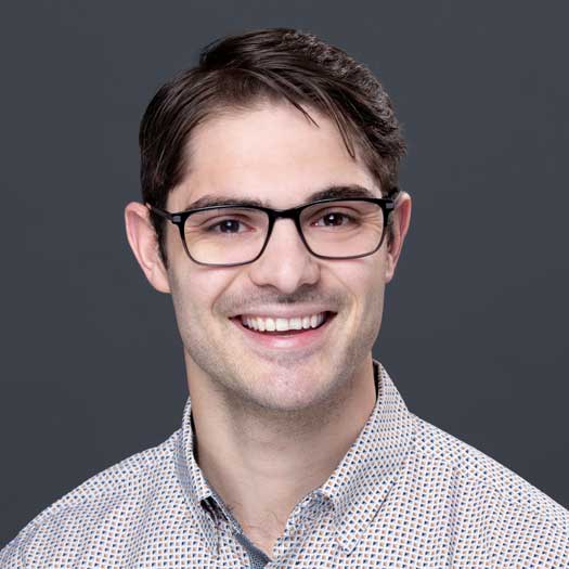 smiling man wearing glasses