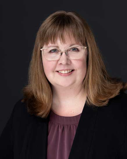 smiling woman wearing glasses