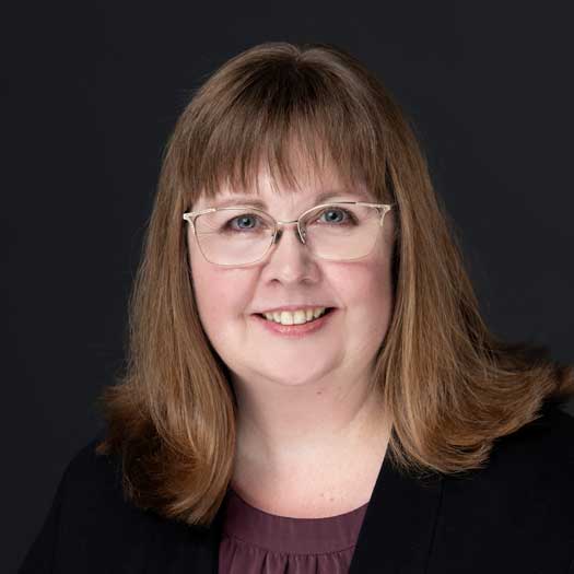 smiling woman wearing glasses