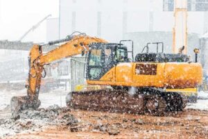 excavator in the snow