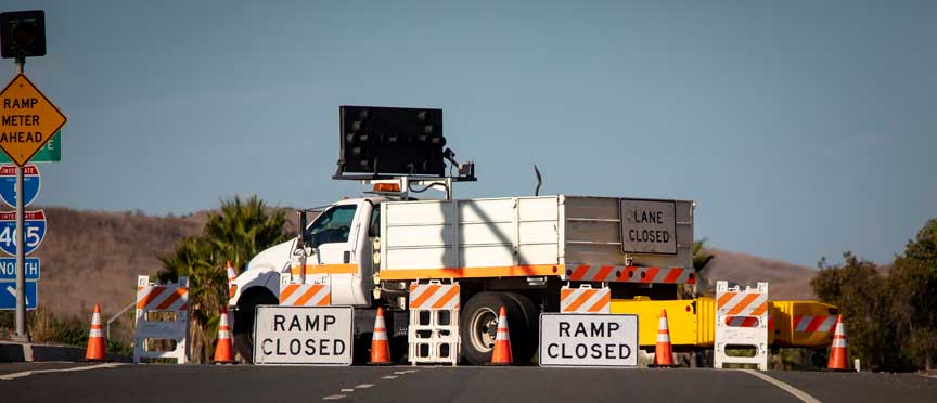 construction truck and ramp closed signs